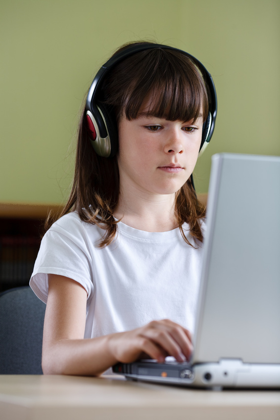 Girl using computer at home